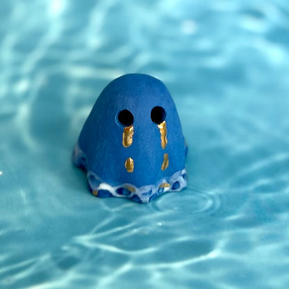Blue Ghost with Gold Tears dripping into the Lake