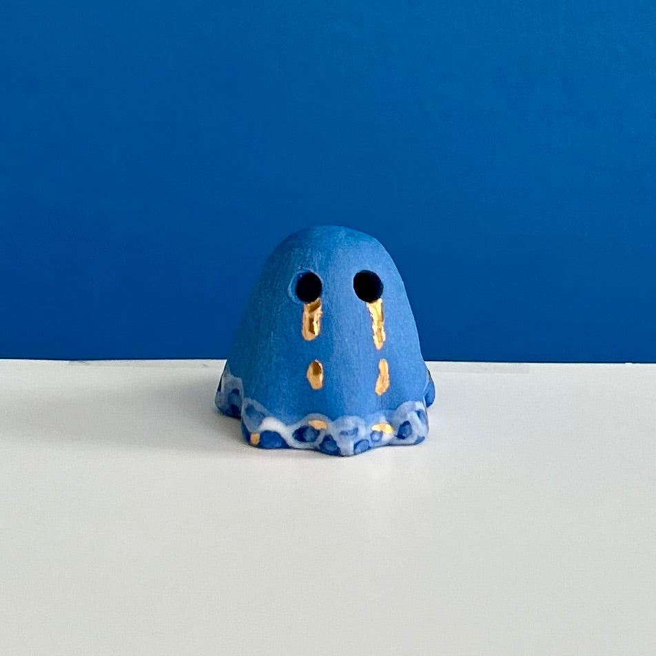 Blue Ghost with Gold Tears dripping into the Lake