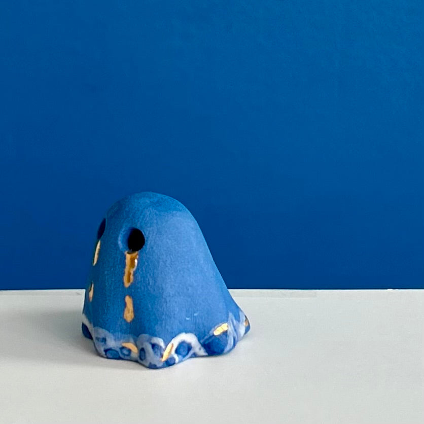 Blue Ghost with Gold Tears dripping into the Lake