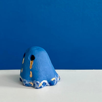 Blue Ghost with Gold Tears dripping into the Lake