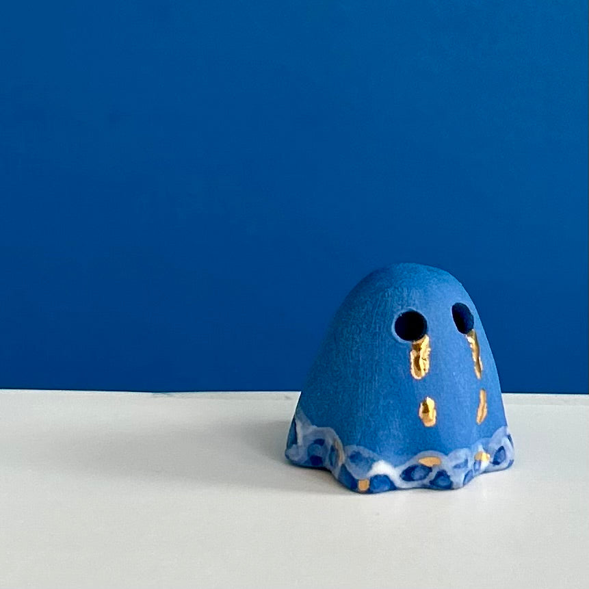 Blue Ghost with Gold Tears dripping into the Lake